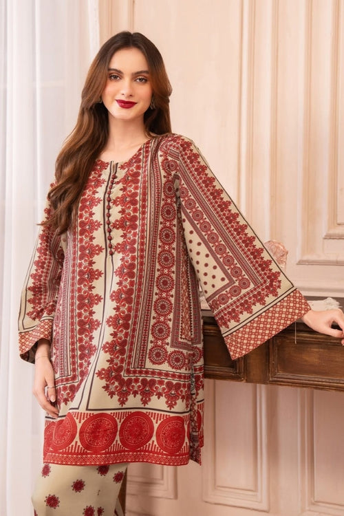 Woman wearing a red and white patterned dress against a neutral background