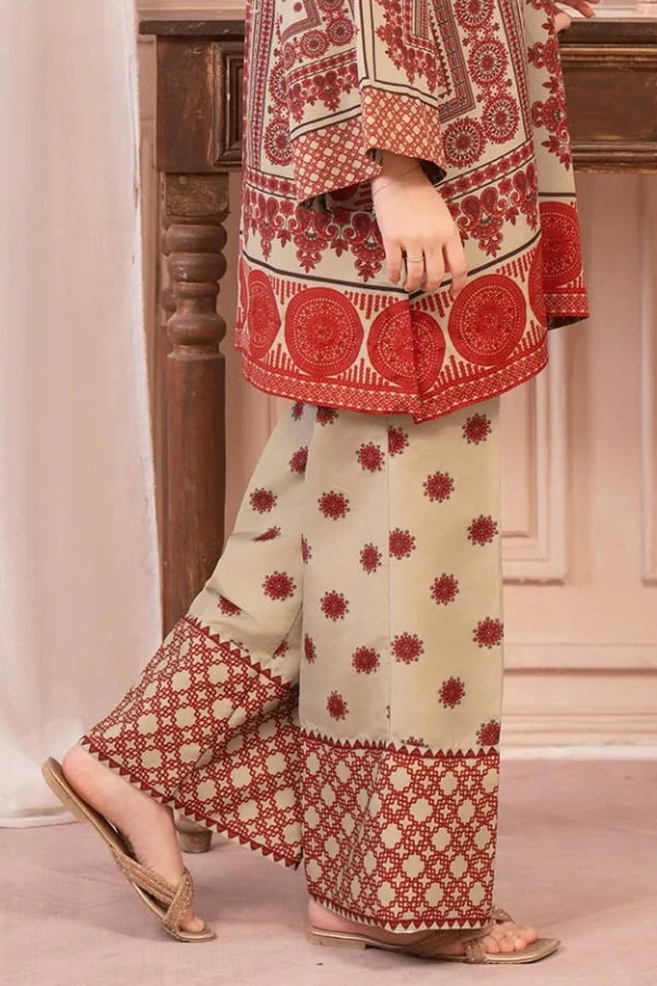 Traditional outfit with red and beige patterns on a neutral background