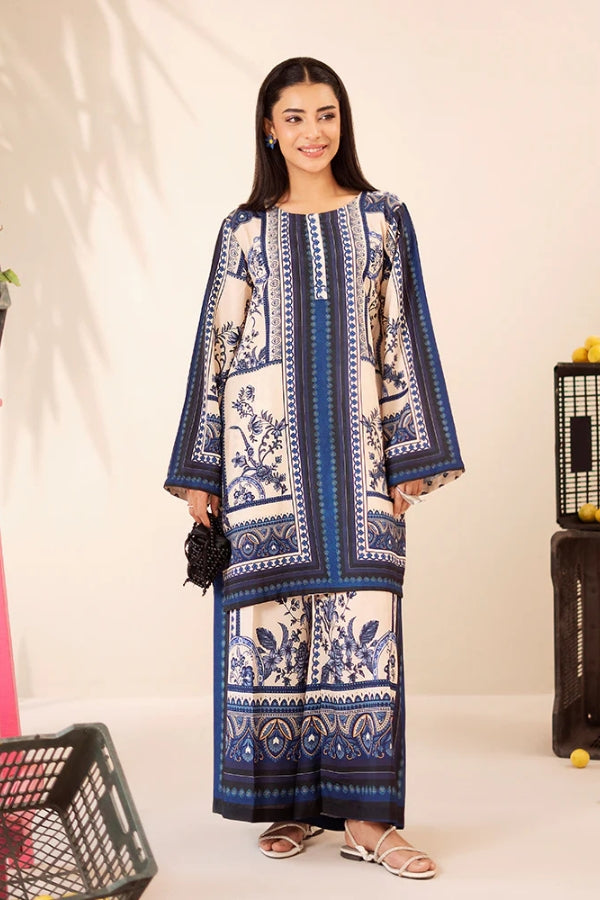 Woman wearing a blue and white patterned dress on a plain background
