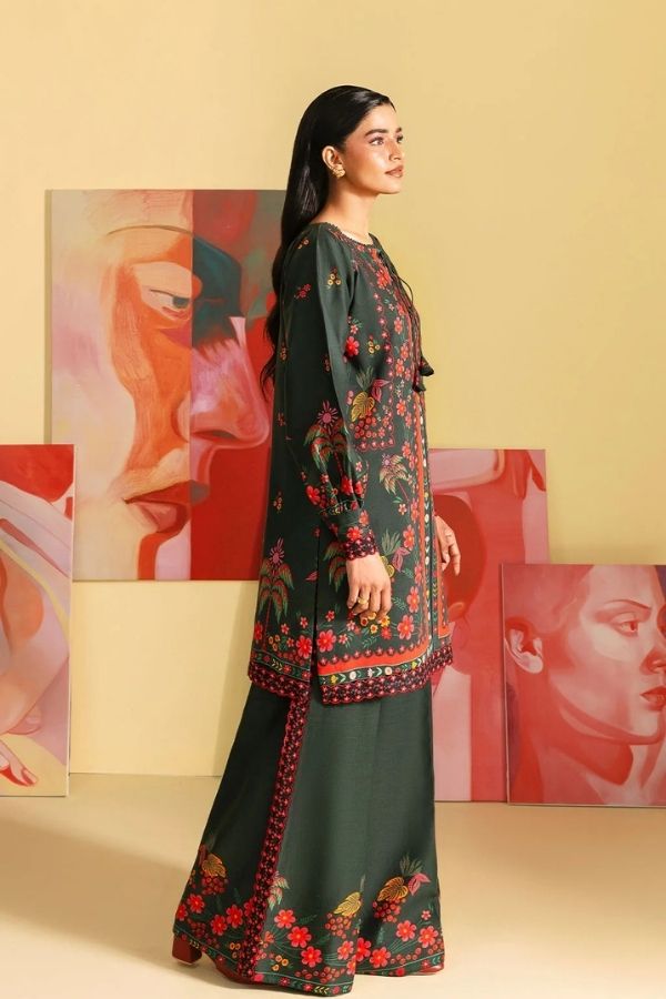 Woman wearing a green floral dress with a colorful background