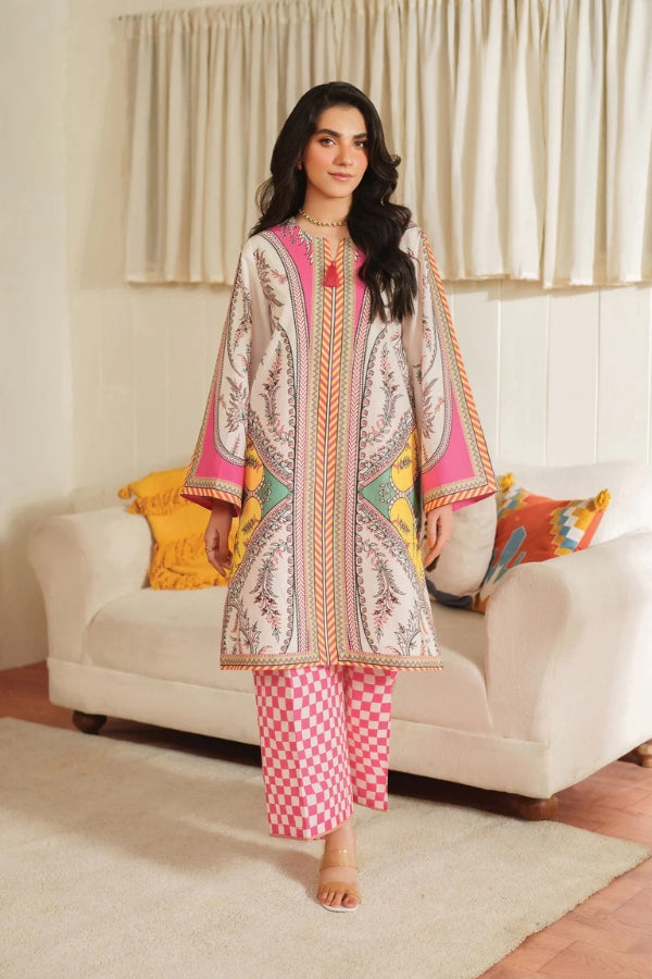 Woman wearing a patterned outfit in a living room setting