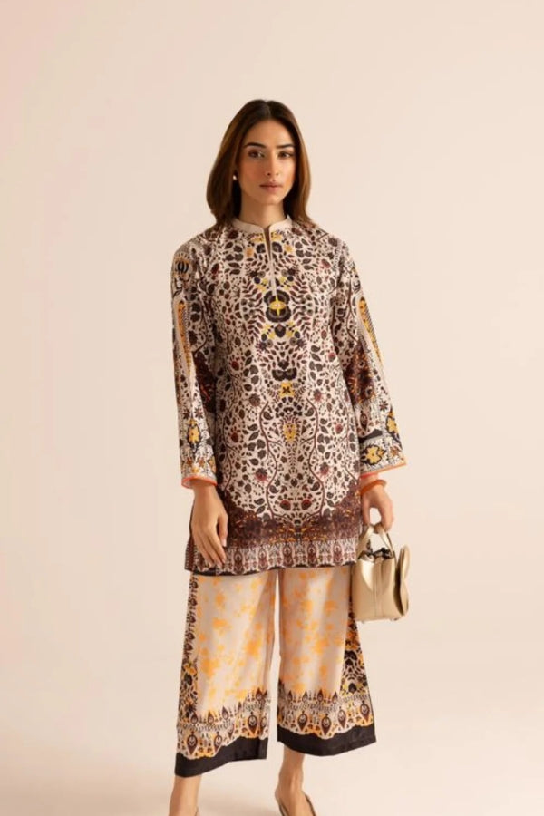 Woman wearing a patterned outfit with a beige background