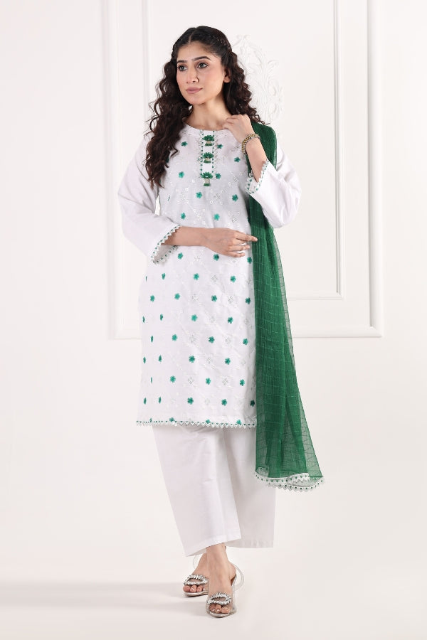Woman wearing a white and green traditional outfit with a white background