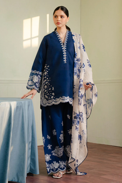 Royal blue Shahnoor 3PC embroidered lawn suit with intricate front embroidery, dyed trouser with embroidered hem, and digitally printed dupatta, displayed elegantly for Eid and festive occasions.