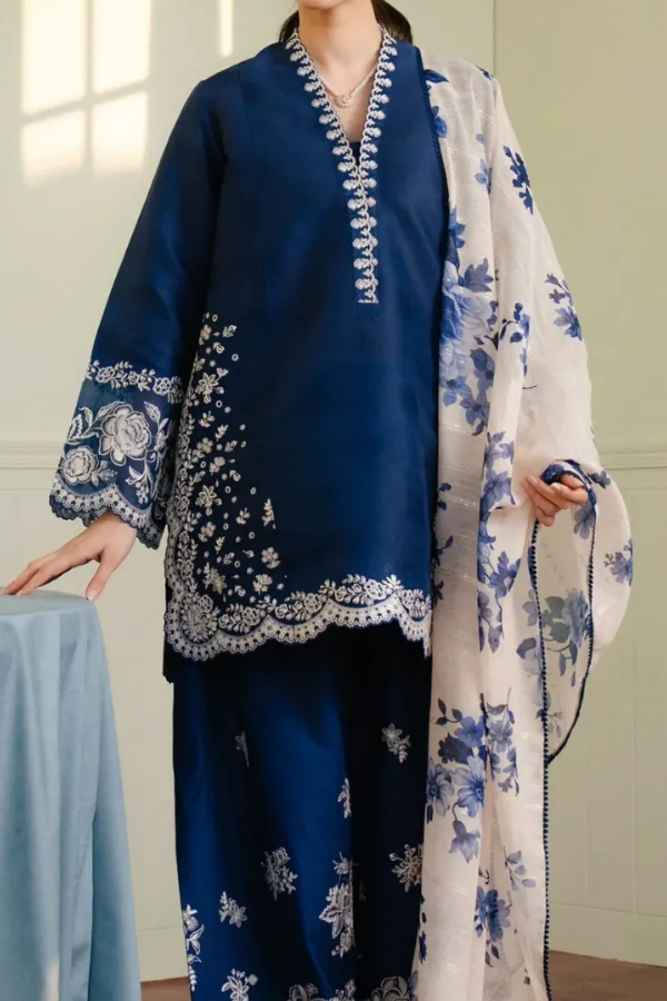 Royal blue Shahnoor 3PC embroidered lawn suit with intricate front embroidery, dyed trouser with embroidered hem, and digitally printed dupatta, displayed elegantly for Eid and festive occasions.