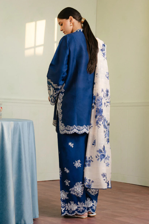 Royal blue Shahnoor 3PC embroidered lawn suit with intricate front embroidery, dyed trouser with embroidered hem, and digitally printed dupatta, displayed elegantly for Eid and festive occasions.