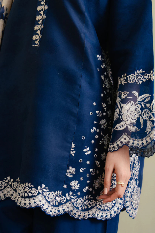 Royal blue Shahnoor 3PC embroidered lawn suit with intricate front embroidery, dyed trouser with embroidered hem, and digitally printed dupatta, displayed elegantly for Eid and festive occasions.