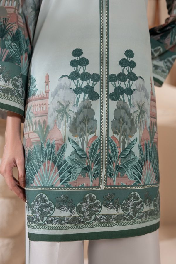 Traditional patterned fabric with green and pink design on a neutral background