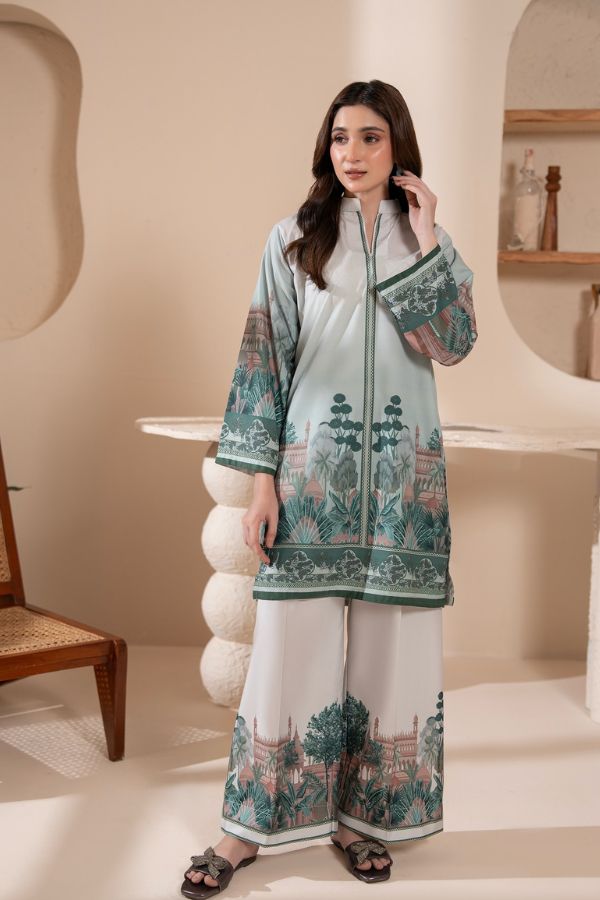 Woman wearing a traditional outfit with floral patterns in a minimalistic setting