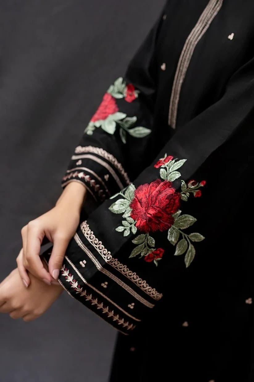 Zarqa Black – 3PC embroidered lawn suit in black with maroon floral detailing, printed contrasting dupatta, and dyed trouser – available in stitched and unstitched options – perfect for Eid and festive daywear by Ragini